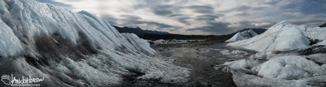 This panoramic image looks back at the glacier, and down the headwaters of the Matanuska River. 